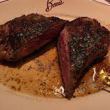 Bone’s Restaurant signature dishes Dry-Aged Steaks, Lobster Bisque, Seafood Tower, Corn Pudding